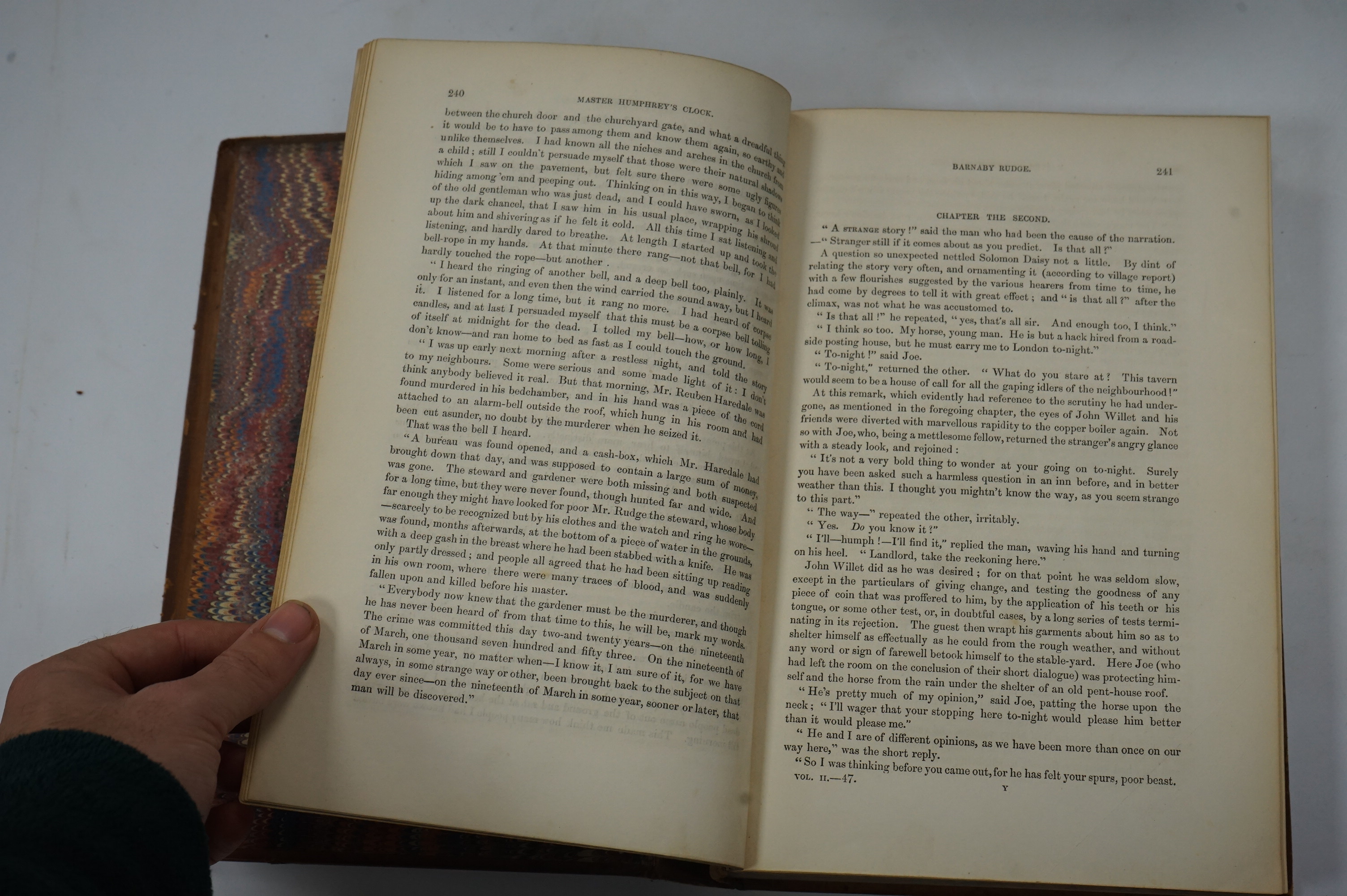 Dickens, Charles - Our Mutual Friend. (new edition), 2 vols. (bound together). pictorial general title, frontispieces and 38 plates; contemp. half calf and marbled boards, gilt decorated panelled spine with red and brown